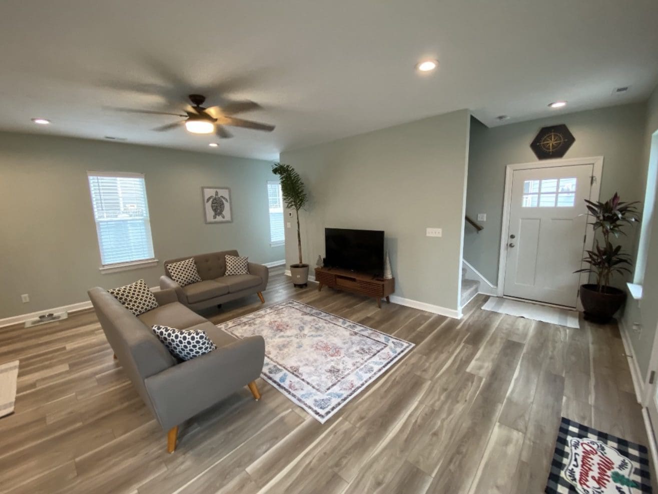 Modern living room with gray sofas and TV